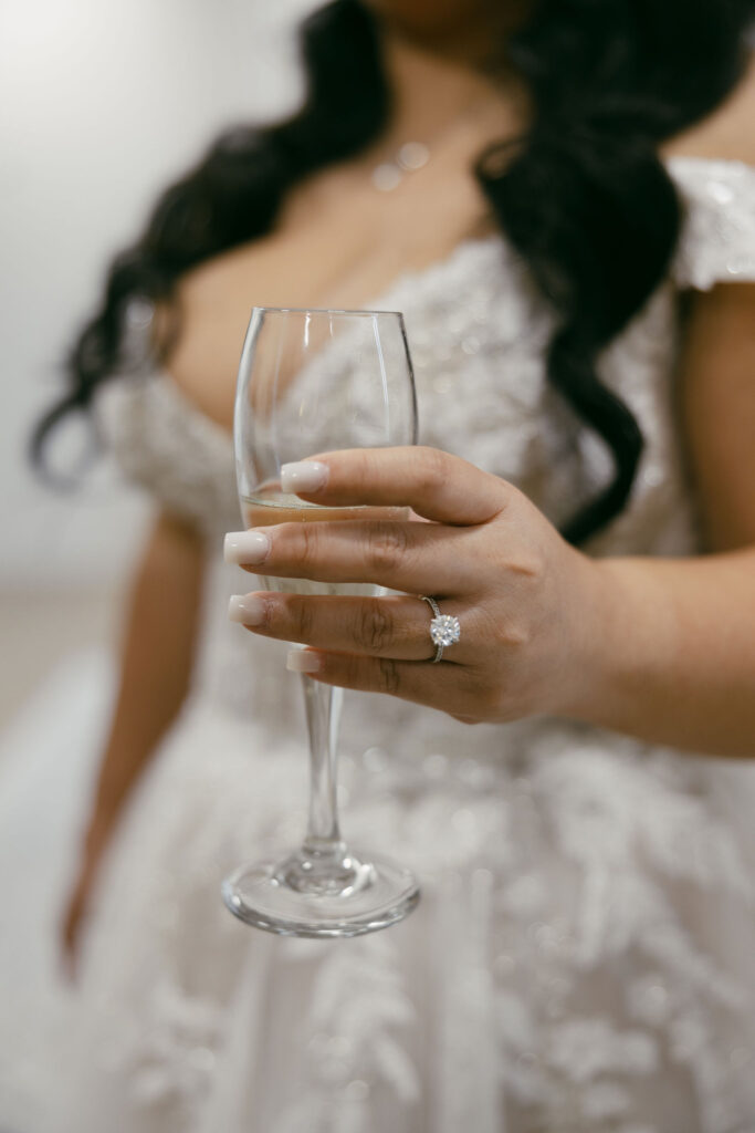 Bride holding a champagne glass