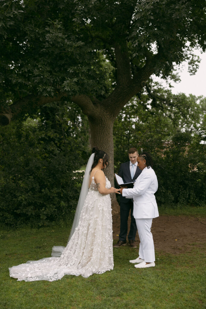 Couple exchanging rings during their intimate Colorado wedding ceremony