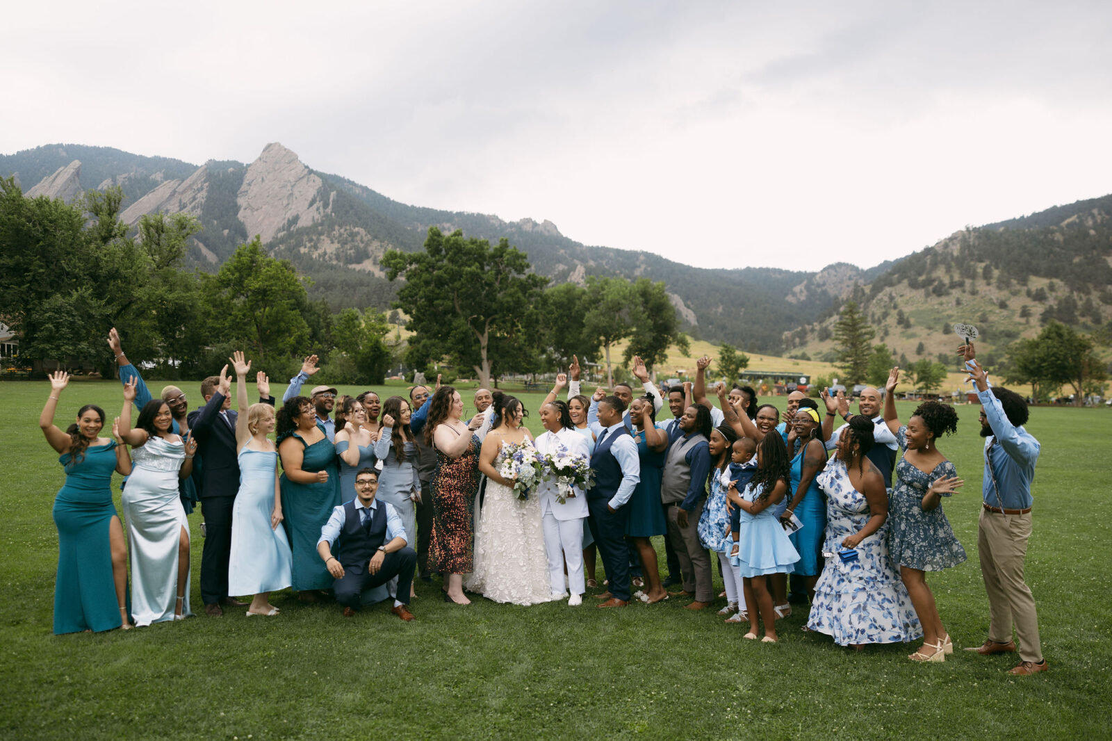 Group shot of a couple with their wedding guests during their Chautauqua Park, Boulder, CO wedding ceremony