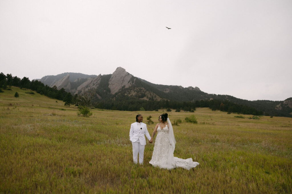 Couple holding hands in the mountains of Boulder, Colorado