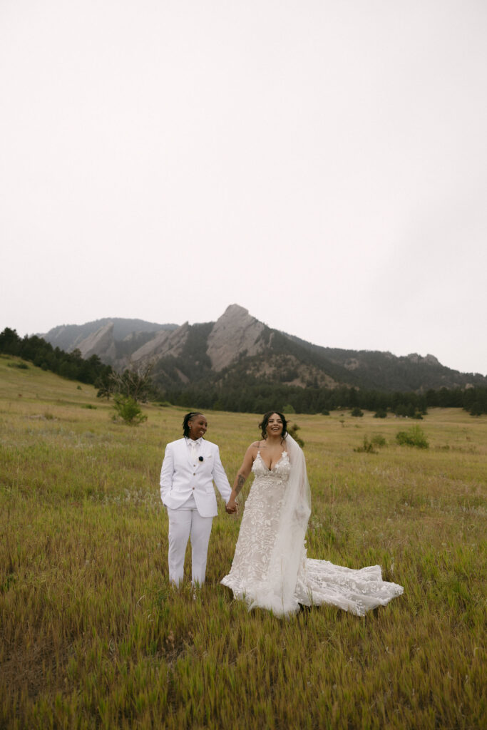 Couple holding hands during their Chautauqua Park wedding photos