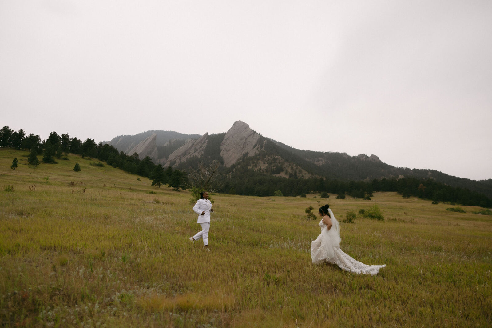 Couple running in the Colorado mountains