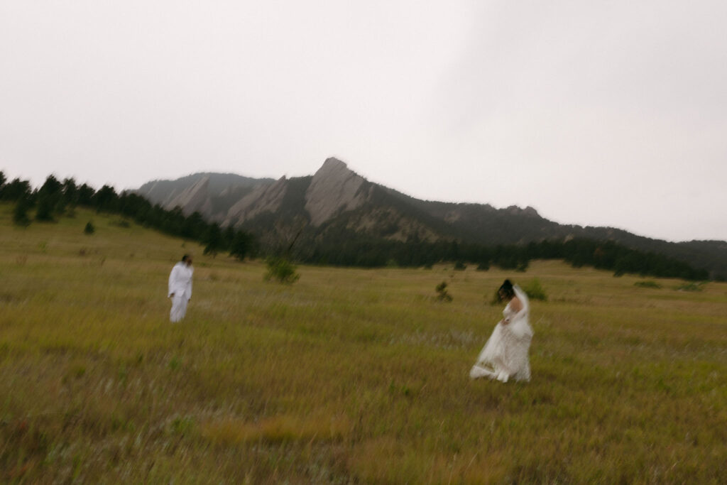 Couple running in the Colorado mountains