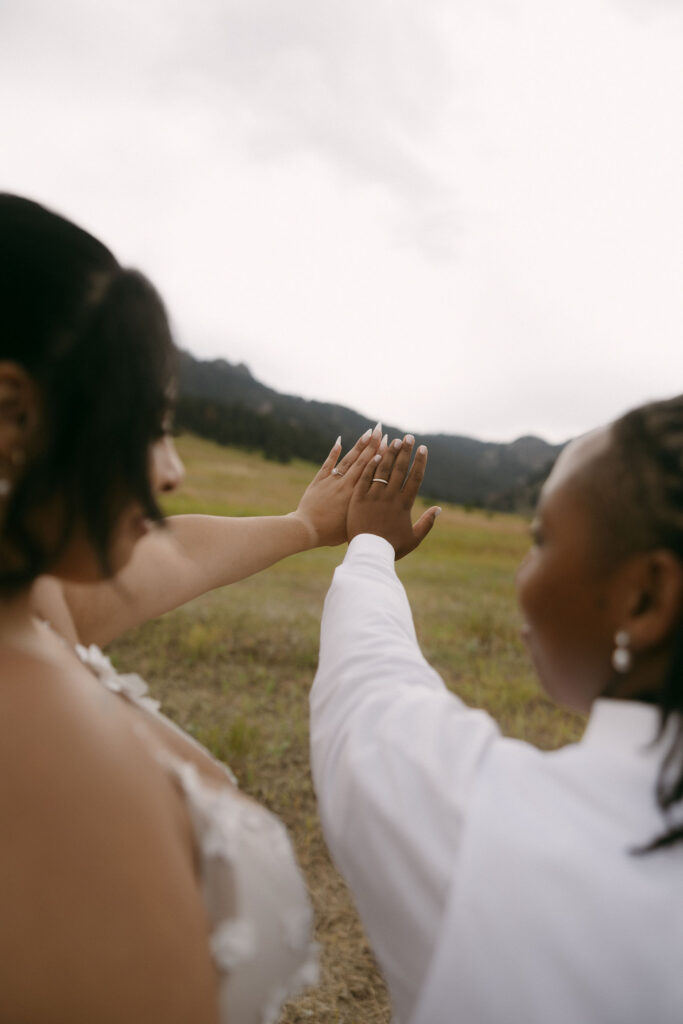 Couple showing off their wedding rings