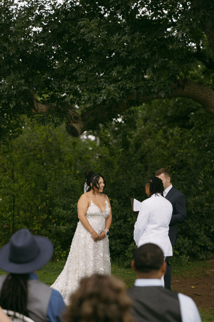 Couple standing at the altar during their Chautauqua Park, Boulder, CO wedding ceremony