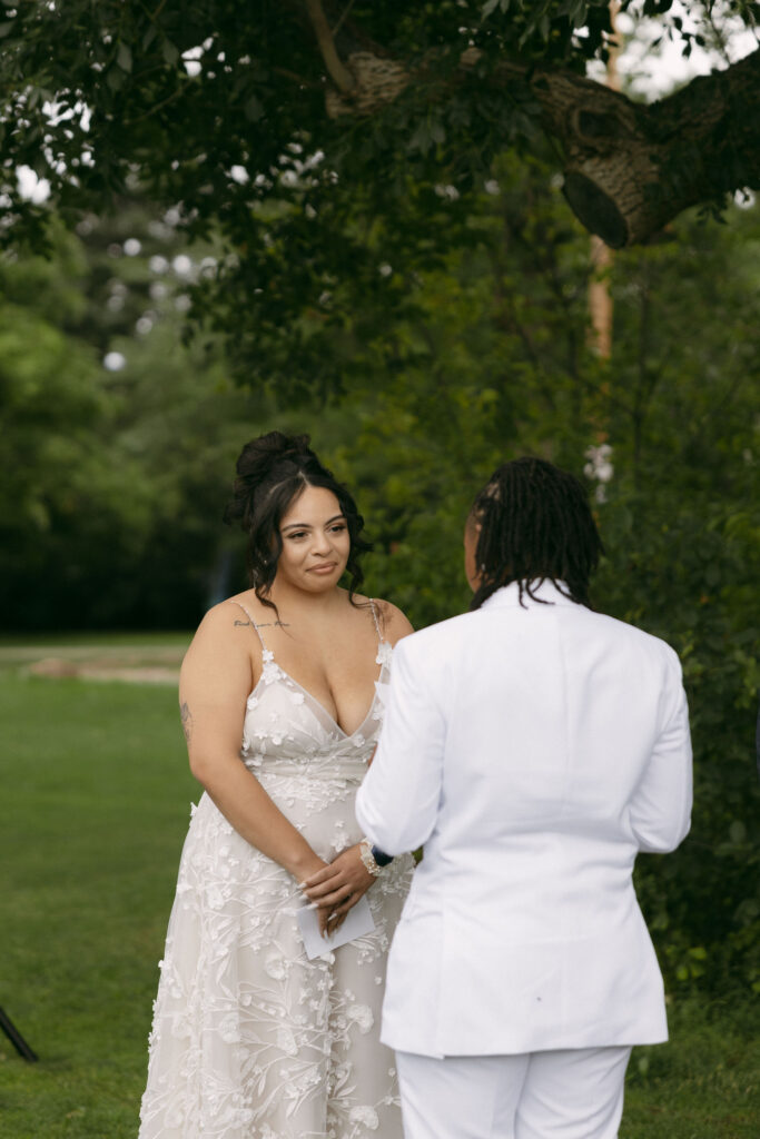 Woman getting emotional during their outdoor wedding ceremony