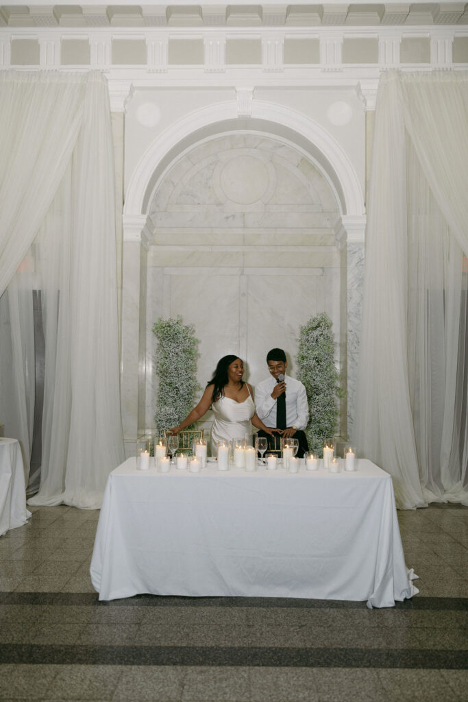 Bride and groom giving speeches 