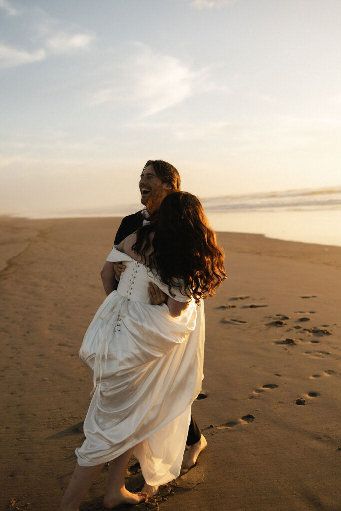 Couple being playful on the Oregon Coast