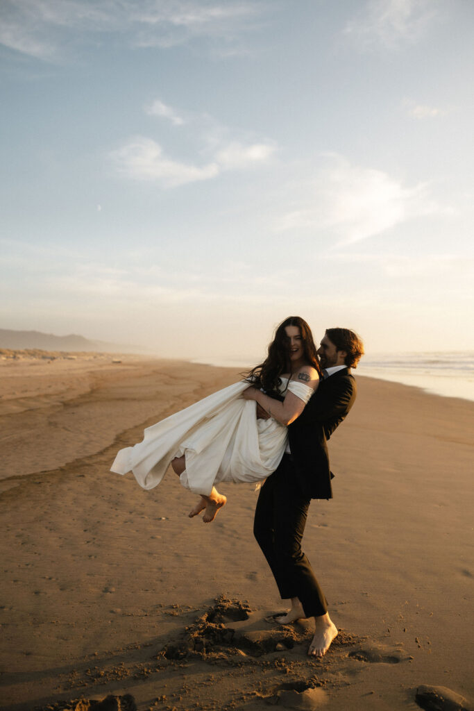 Couple being playful on the Oregon Coast