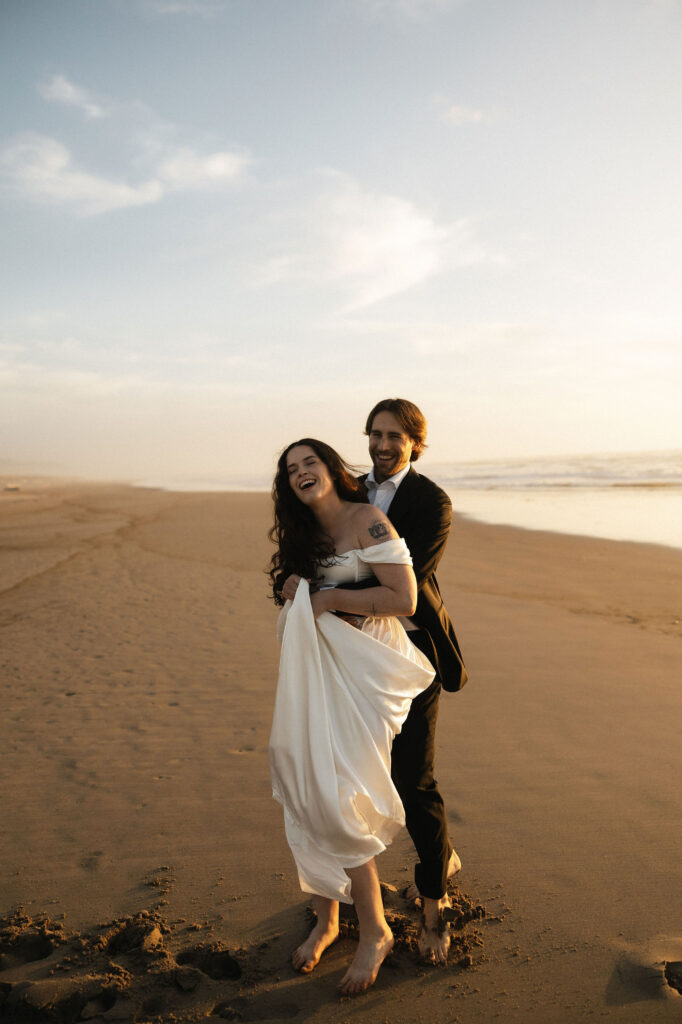 Couple being playful on the Oregon Coast