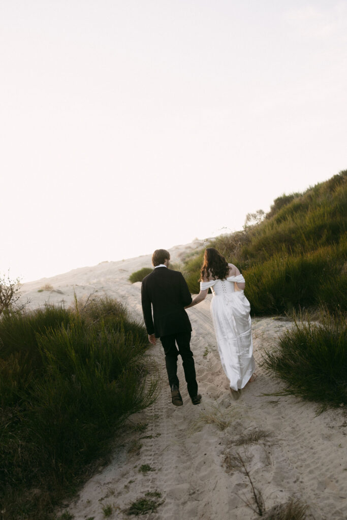 Couple walking up to the beach