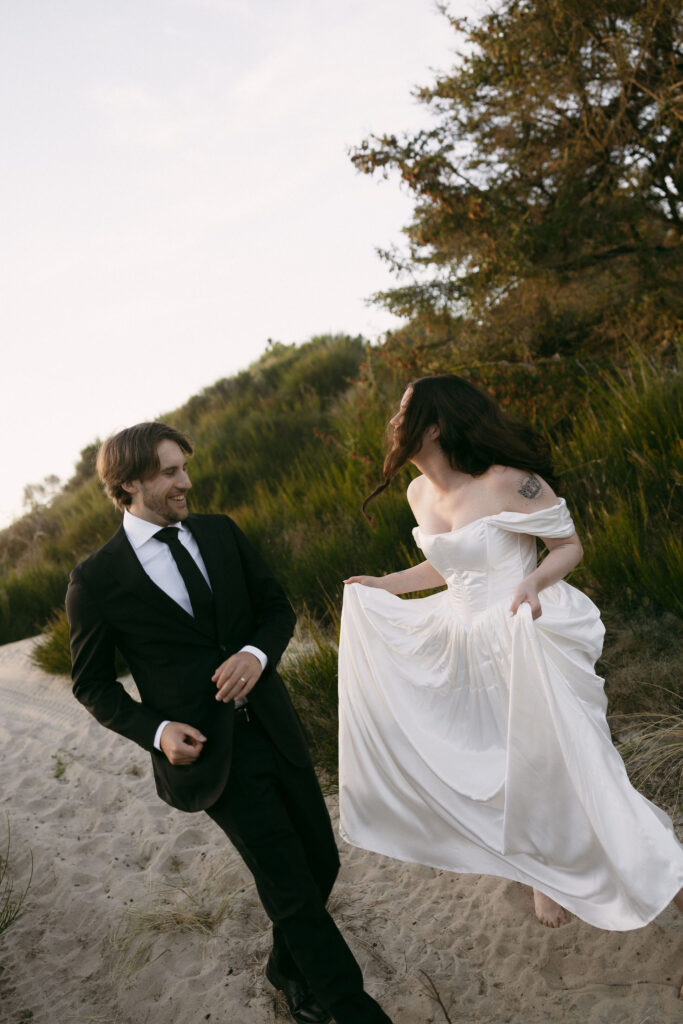 Couple running down a hill