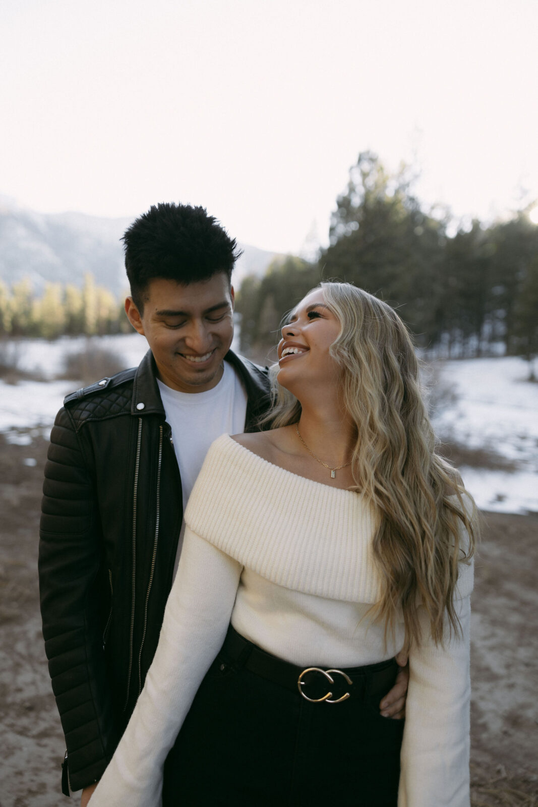 Couple posing and laughing during their couples photoshoot - Couples Poses For Photos