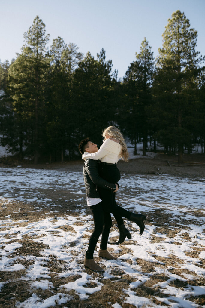 Man twirling his partner during their Mt Charleston photoshoot