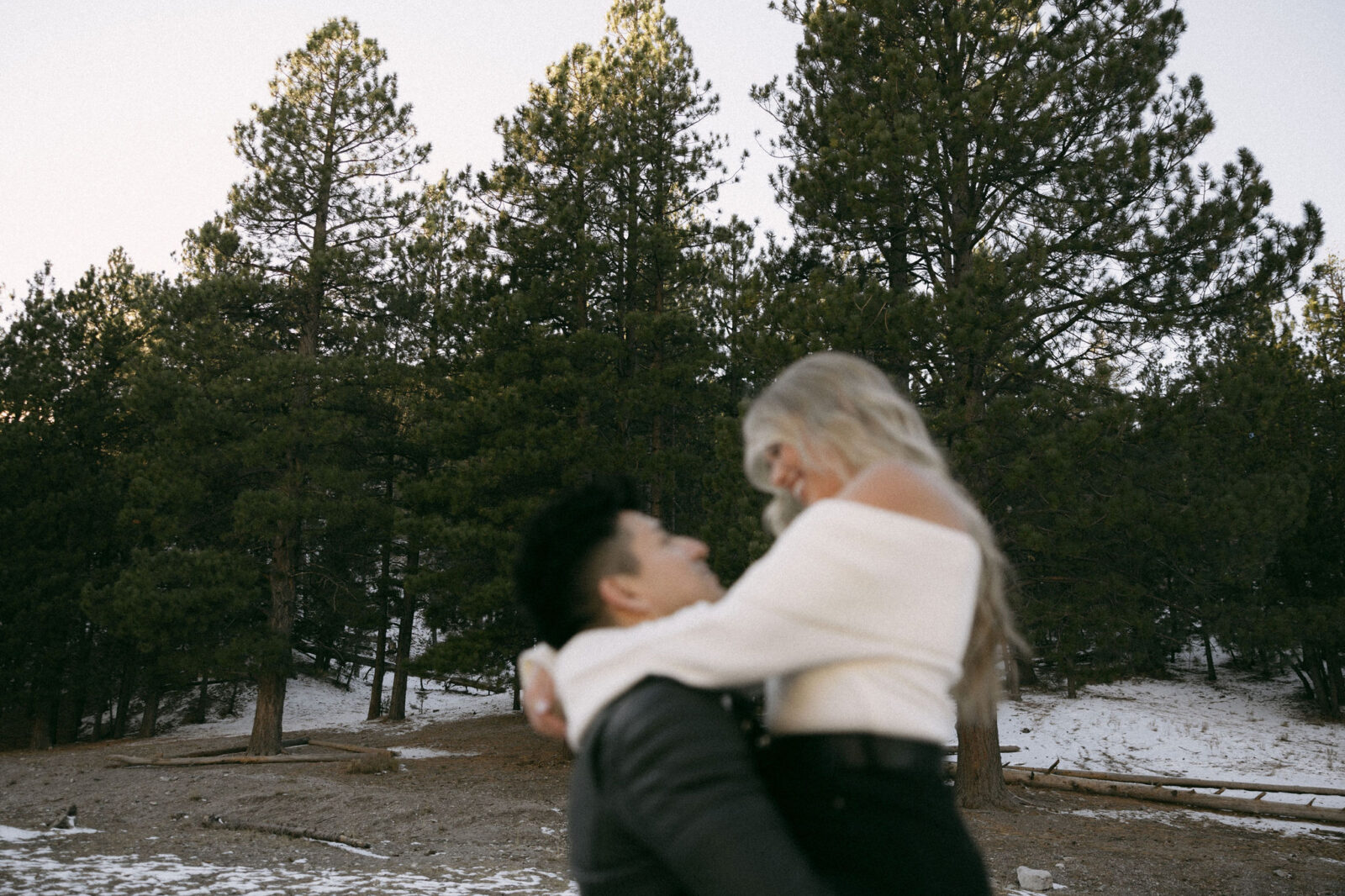 Man lifting up his partner during their couples photoshoot - Couples Poses For Photos