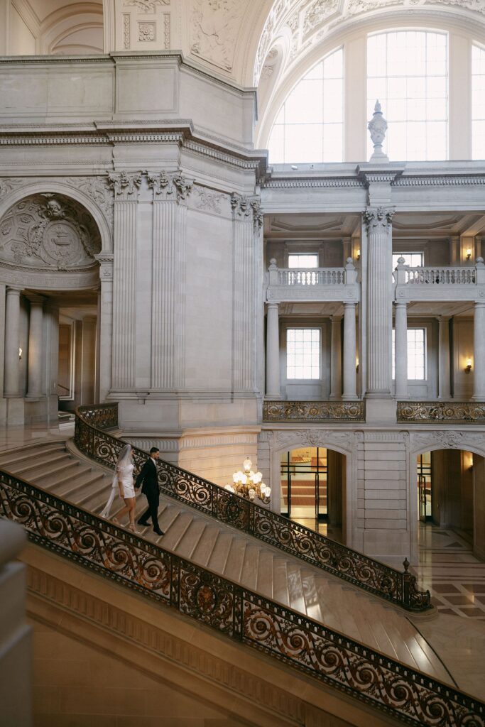 Couple walking down the grand staircase