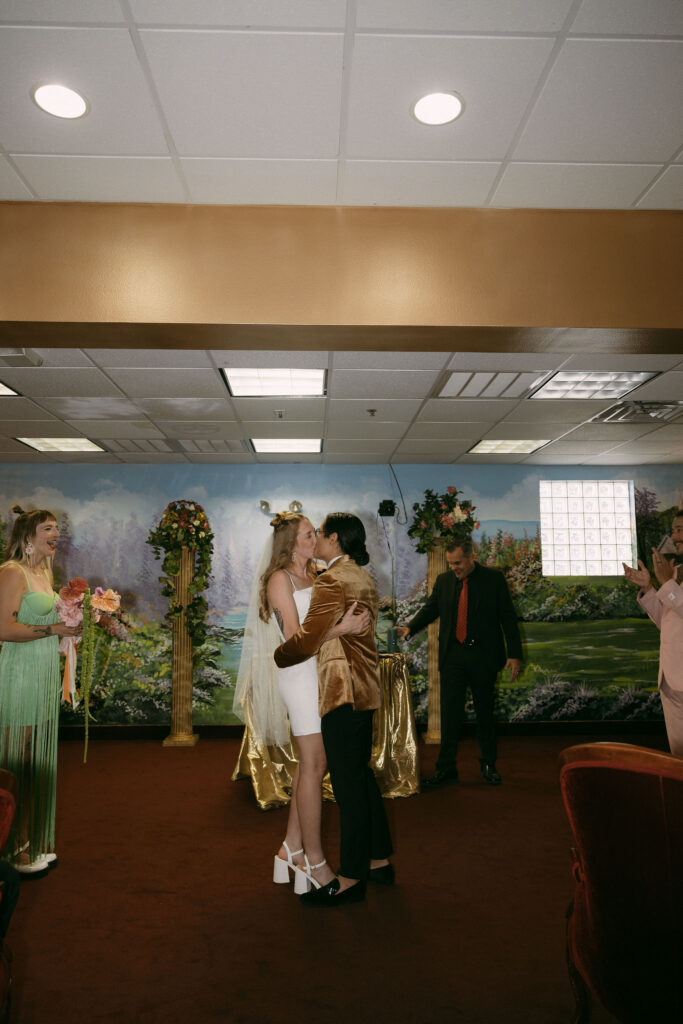 Bride and groom kissing during their Chapel Amore wedding ceremony in Las Vegas