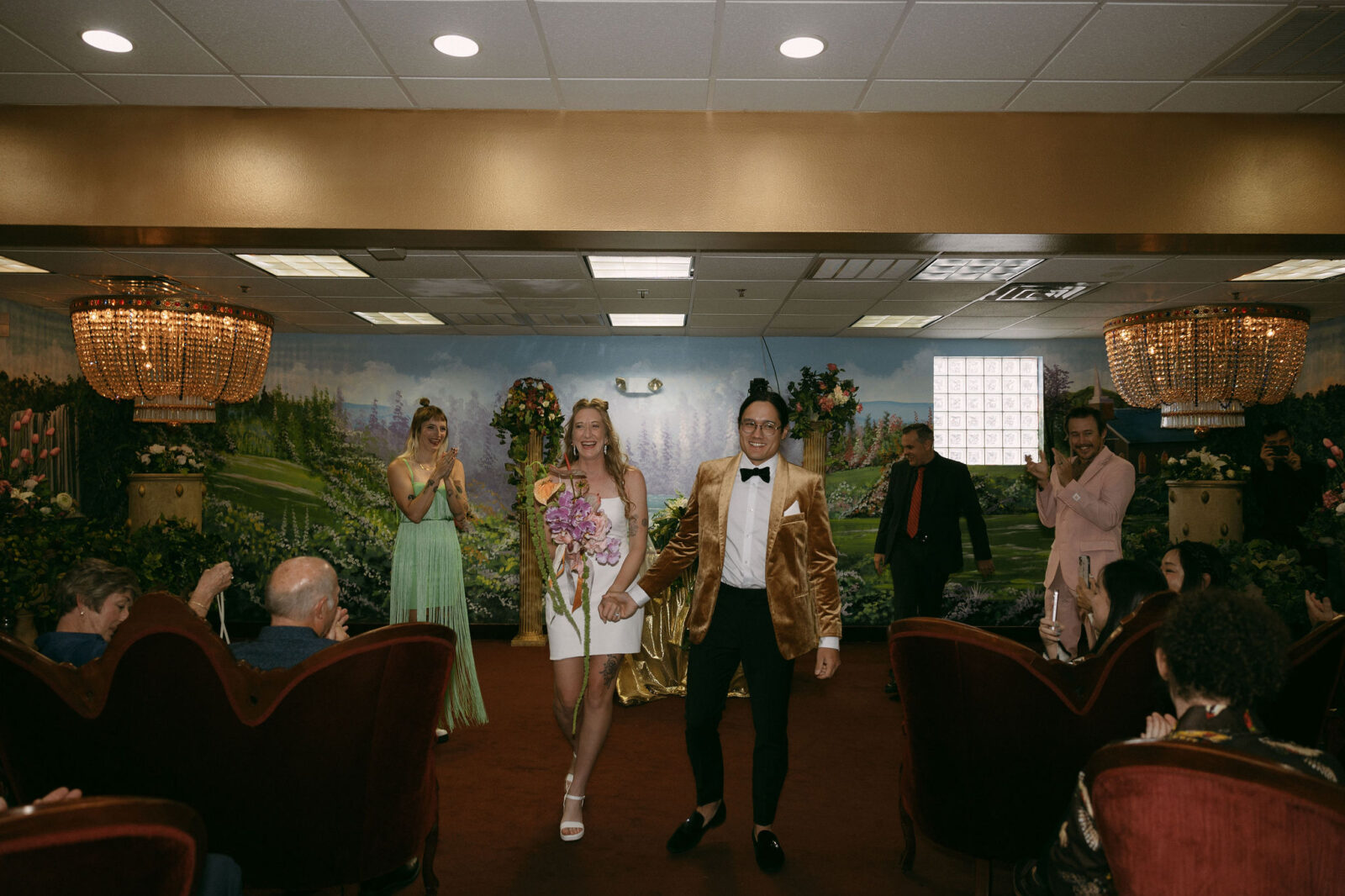 Bride and groom walking back the aisle as husband and wife after their Chapel Amore wedding ceremony in Las Vegas