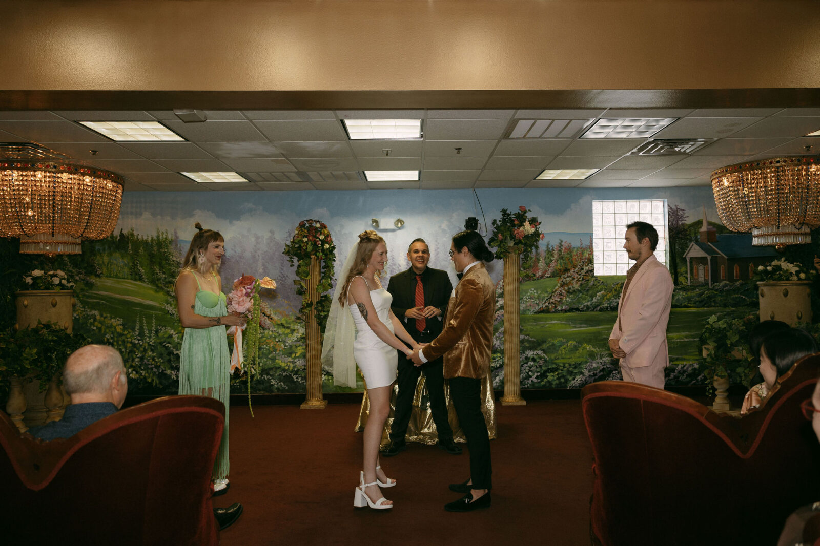 Bride and groom holding hands during their Chapel Amore Las Vegas wedding ceremony