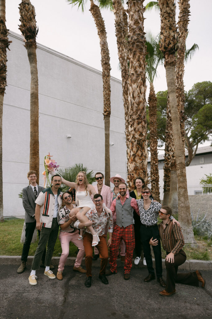 Bride posing with friends after her Las Vegas wedding