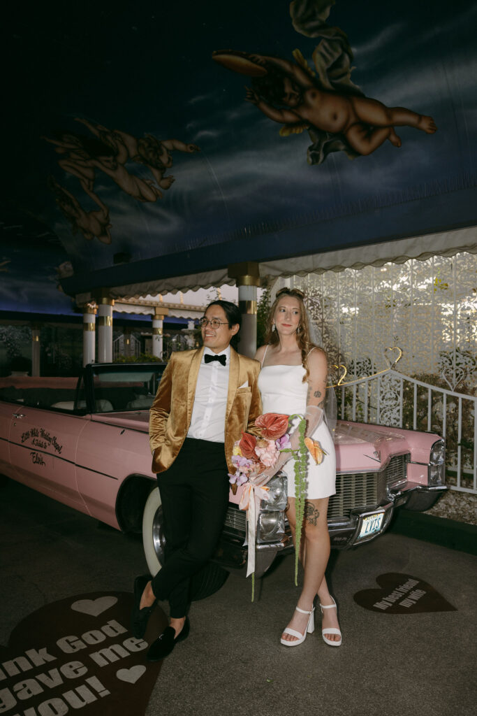 Bride and grooms Pink Cadillac wedding photos at The Little White Chapel