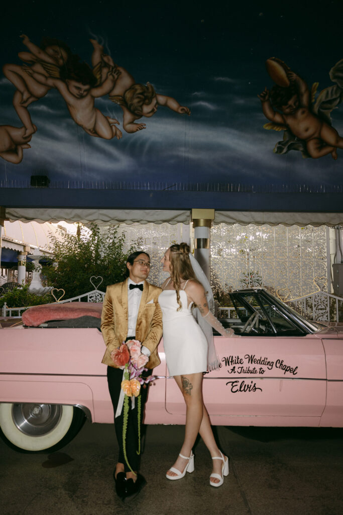 Bride and grooms Pink Cadillac wedding photos at The Little White Chapel