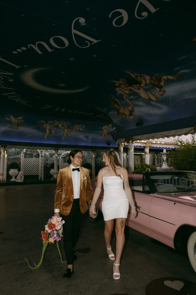 Bride and grooms Pink Cadillac wedding photos at The Little White Chapel