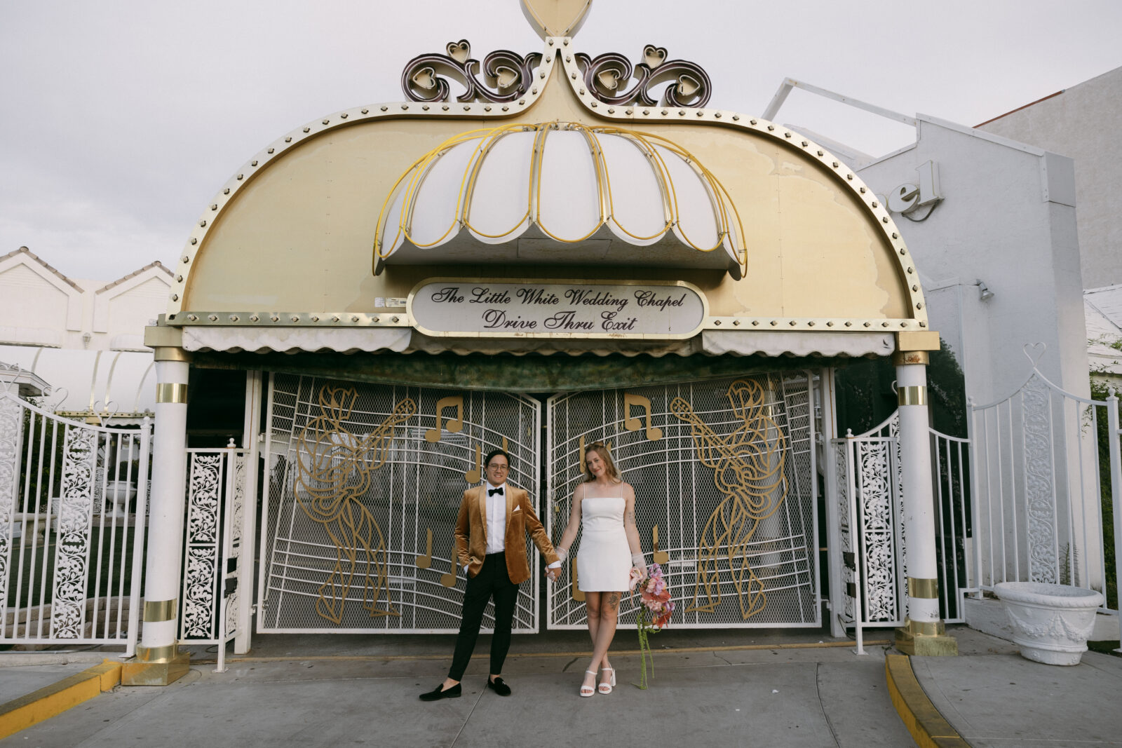 Bride and groom posing for their Little White Wedding Chapel elopement photos