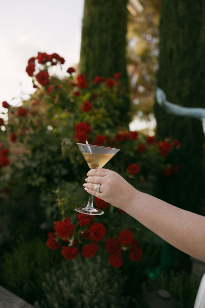 Bride holding a cocktail