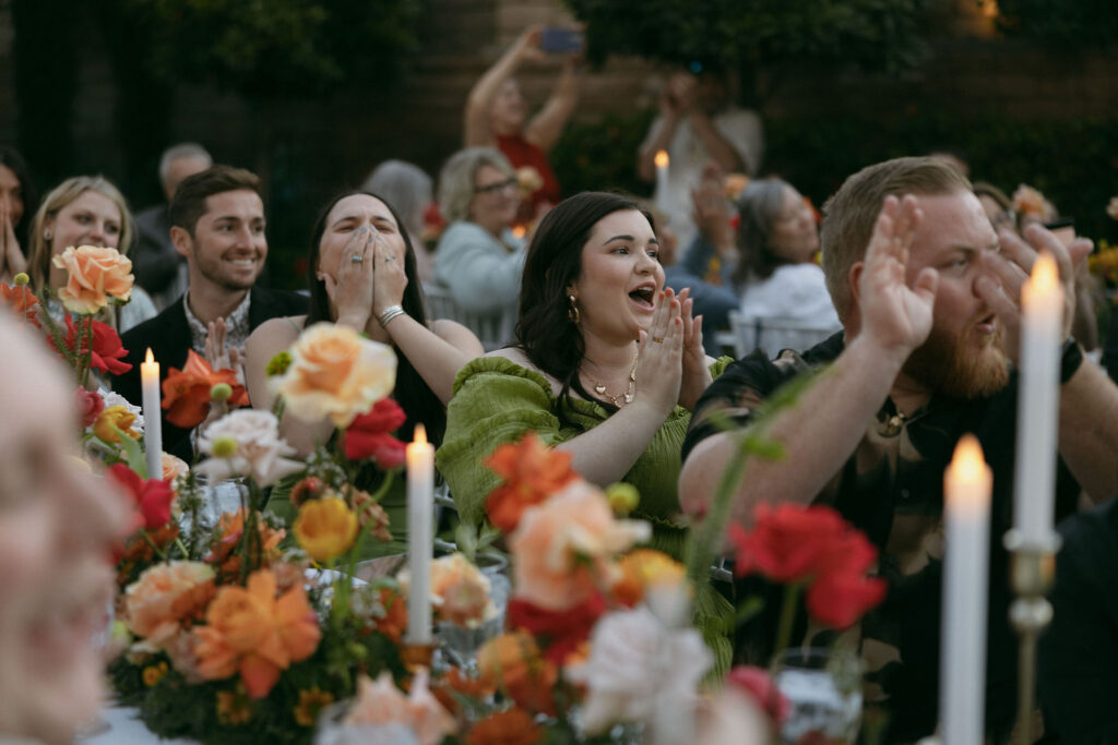 Guests clapping after the bride and grooms first dance