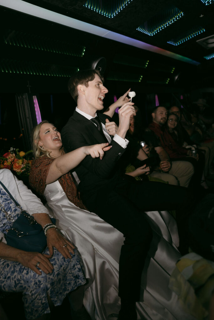 Groom dancing on the party bus