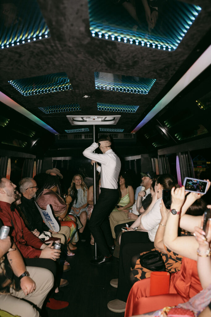 Groom dancing on the party bus