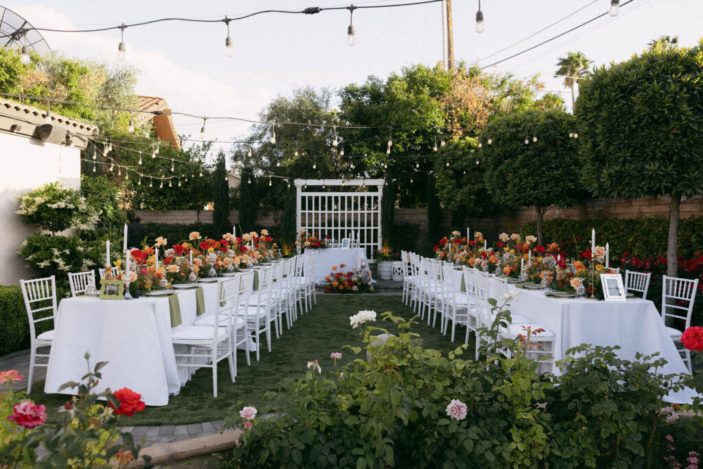 A colorful outdoor garden wedding reception at Midcentury Manor in Las Vegas