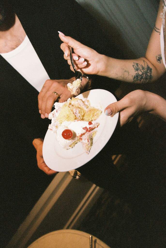 Couple cutting into their elopement cake