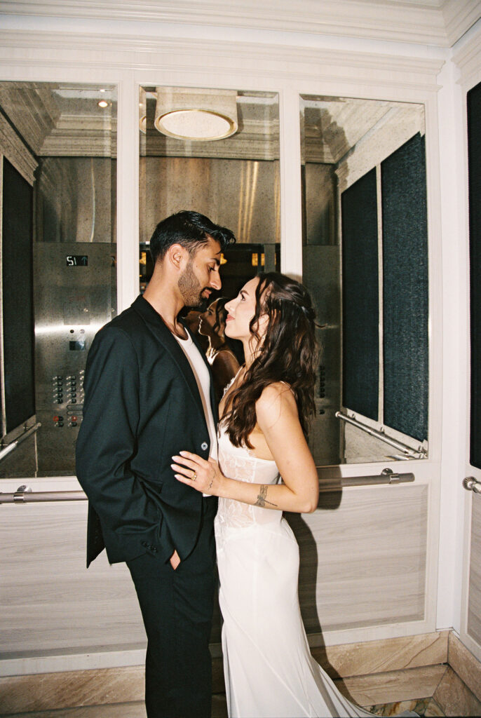 Couple posing in a hotel elevator in Vegas
