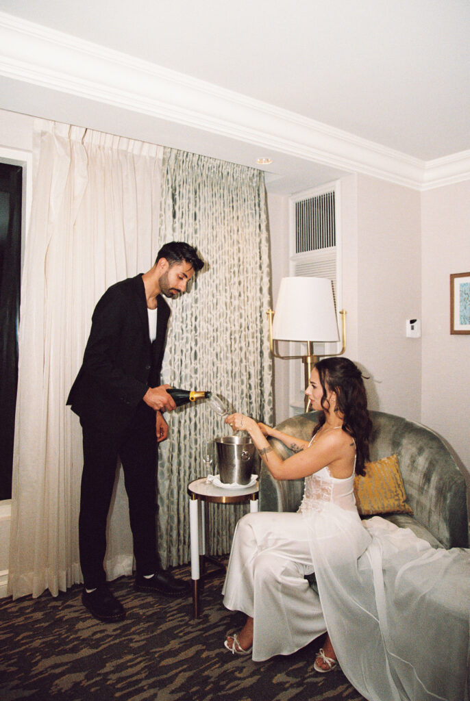 Couple pouring glasses of champagne