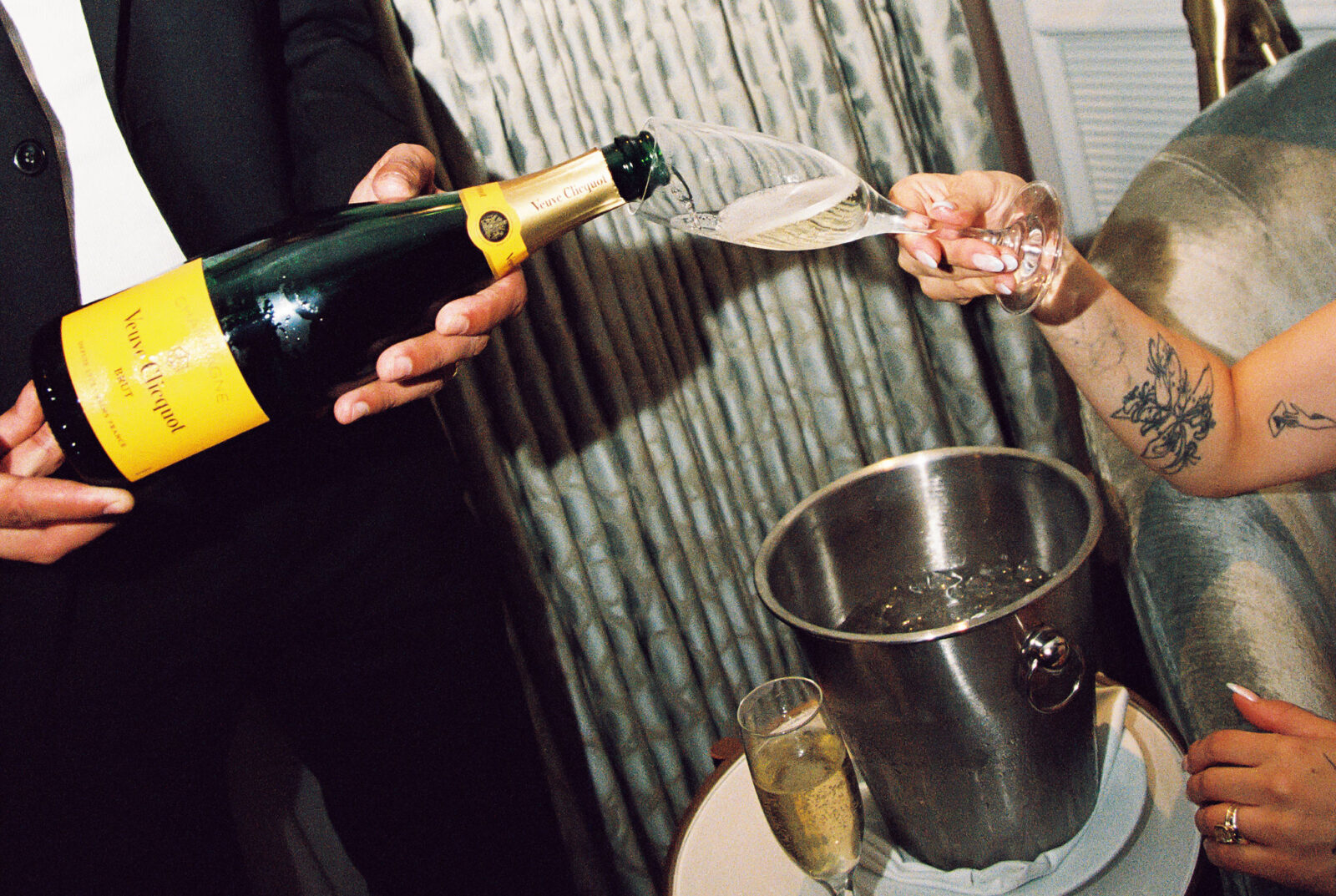 Couple pouring glasses of champagne
