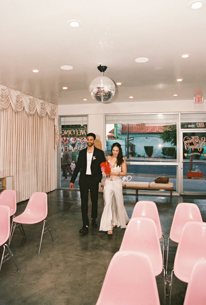 Bride and groom walking to the altar together at Sure Thing Chapel