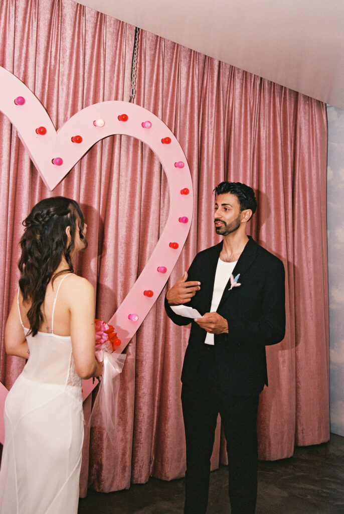 Groom reading his vows to his bride
