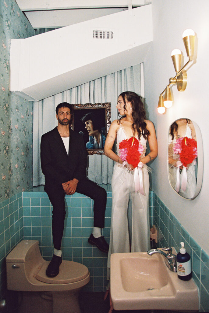 Film Las Vegas elopement photos in the bathroom at Sure Thing Chapel