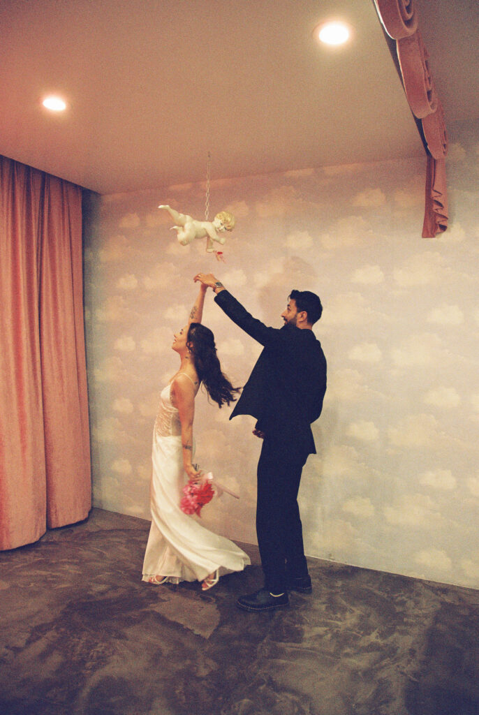 Groom twirling his bride around during their Sure Thing Chapel elopement