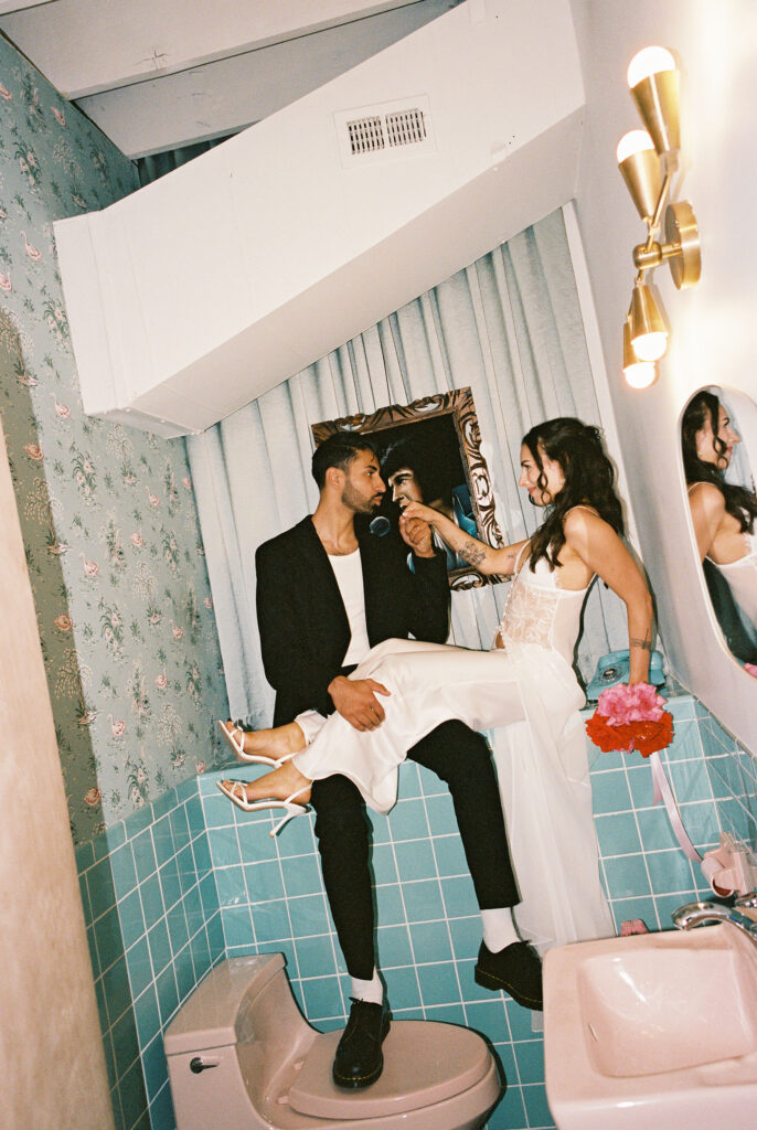 Film Las Vegas elopement photos in the bathroom at Sure Thing Chapel