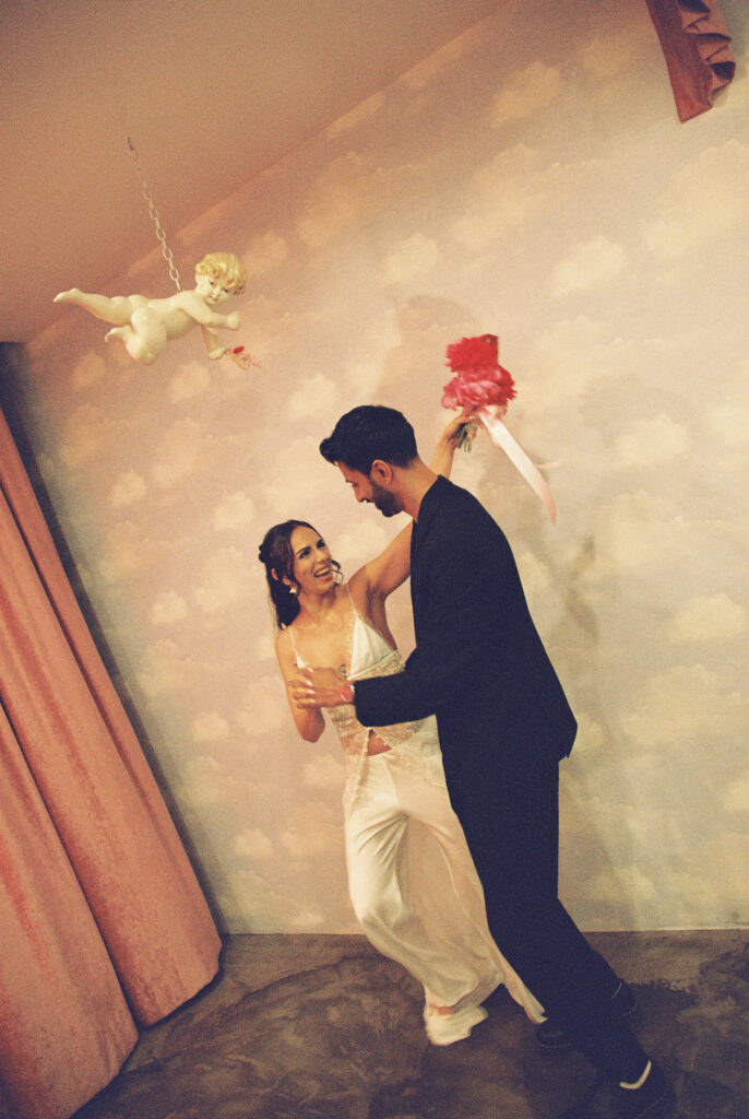 Groom twirling his bride around during their Sure Thing Chapel elopement