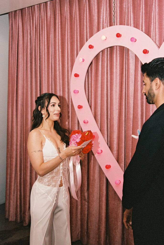 35mm film photo of a bride reading her vows to her groom