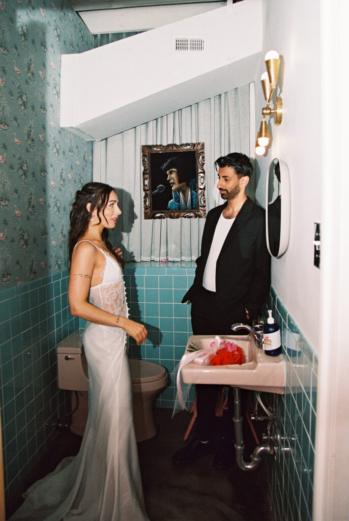 Film Las Vegas elopement photos in the bathroom at Sure Thing Chapel