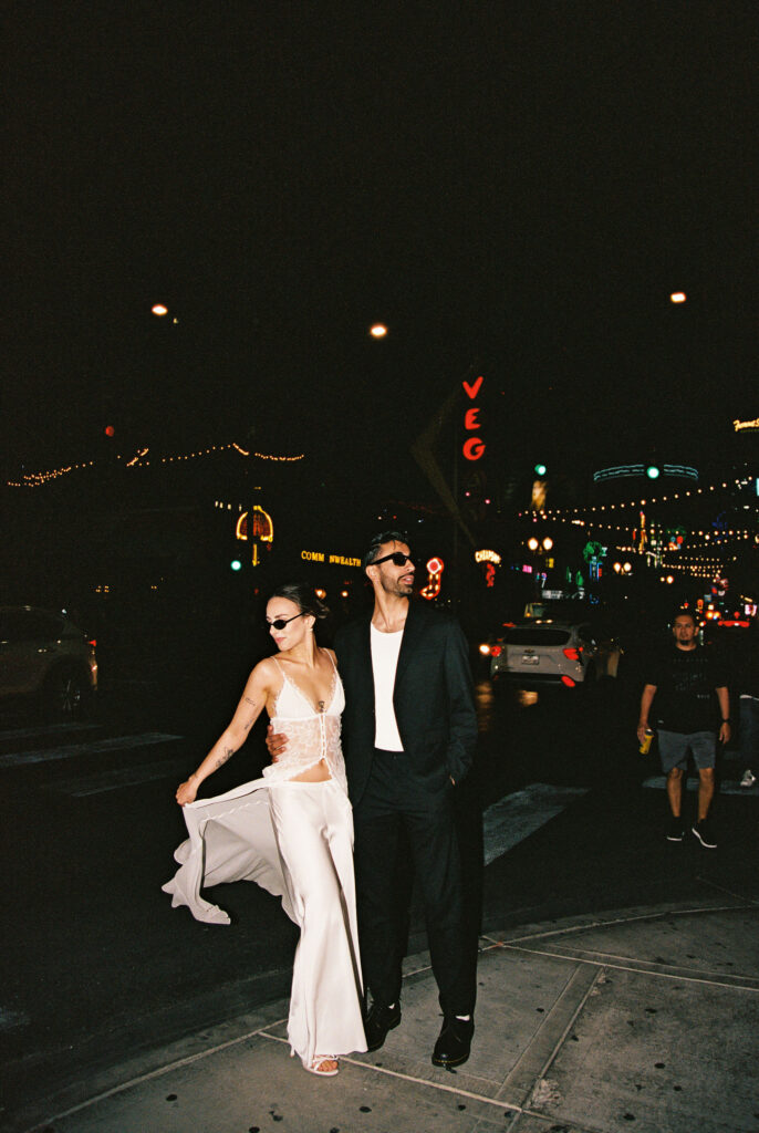 Flash film elopement photos in Las Vegas in front of the Vegas sign