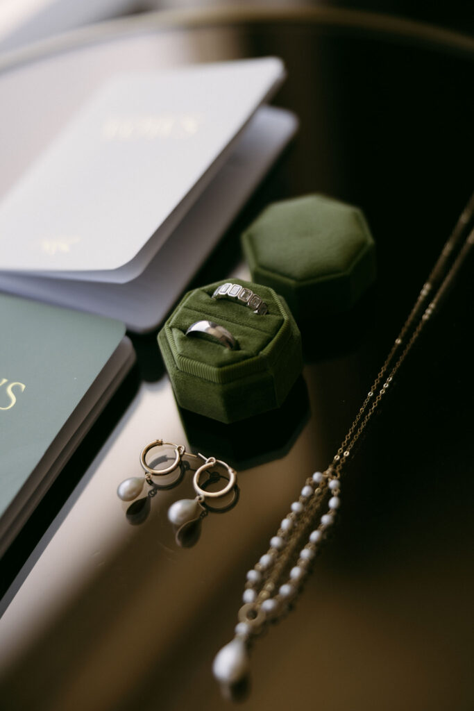 Las Vegas wedding details with jewelry and vow books