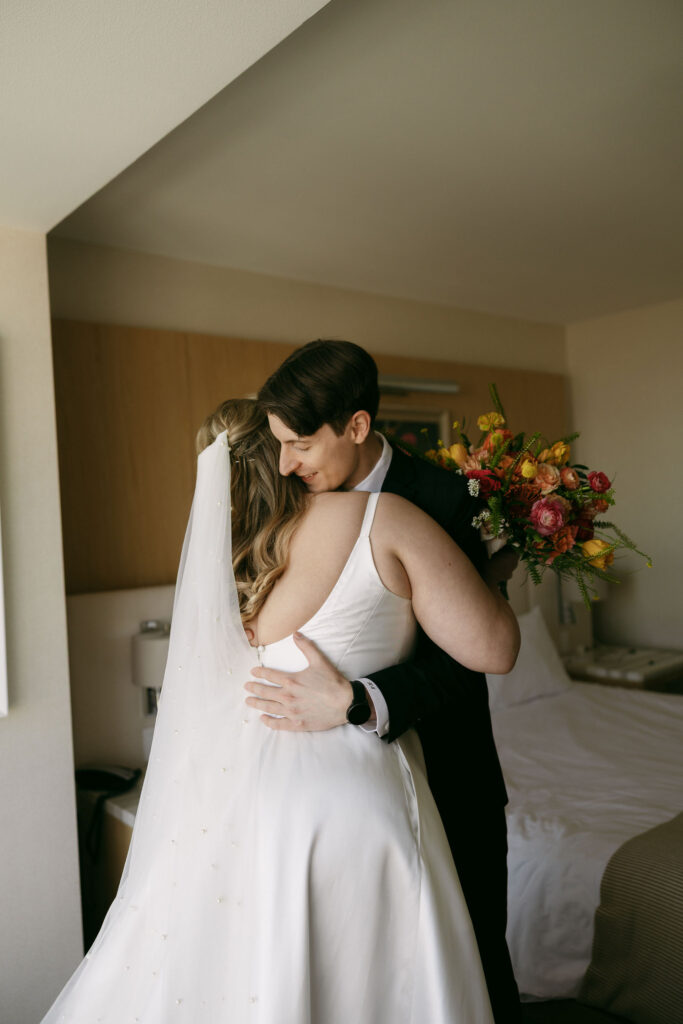 Bride and groom hugging during their first look