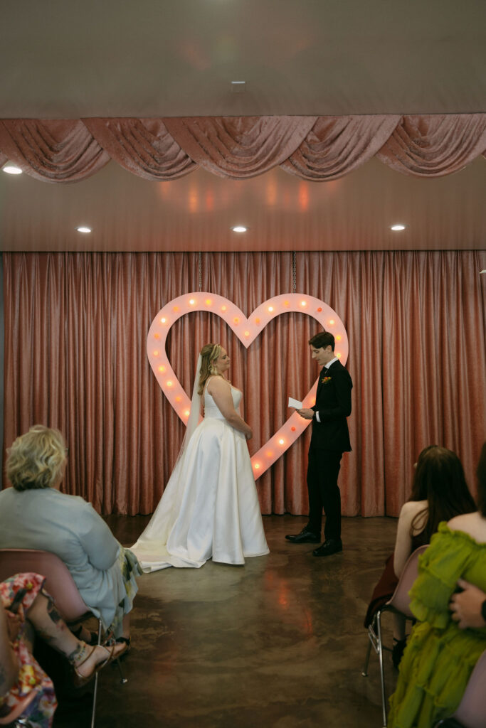 Groom reading his vows to his bride