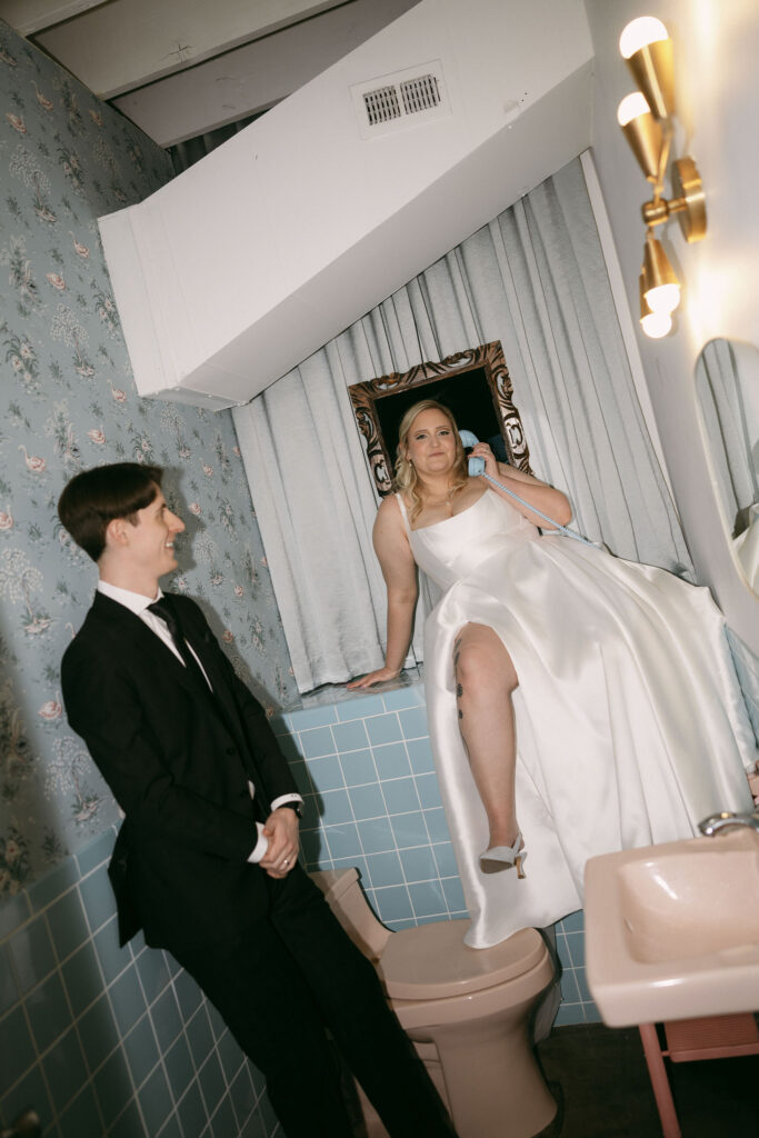 Bride and groom posing in the bathroom at Sure Thing Chapel in Las Vegas